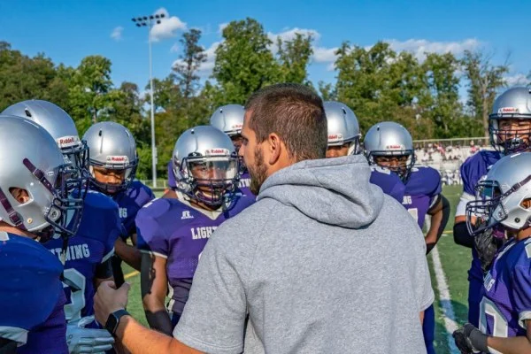 american football team huddle